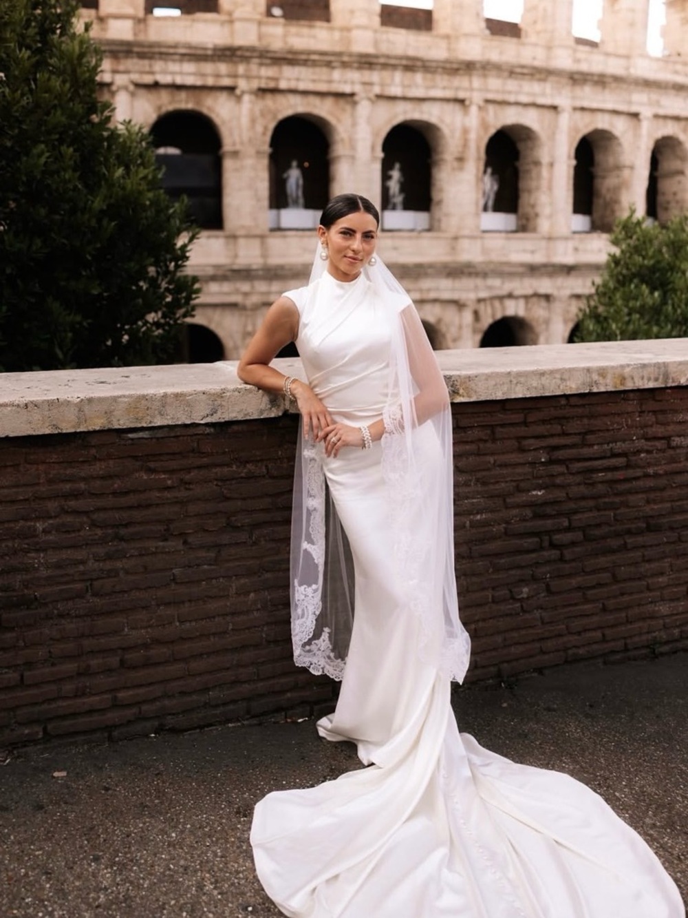 Elegant White Satin Wedding Gown with Lace-Edged Veil